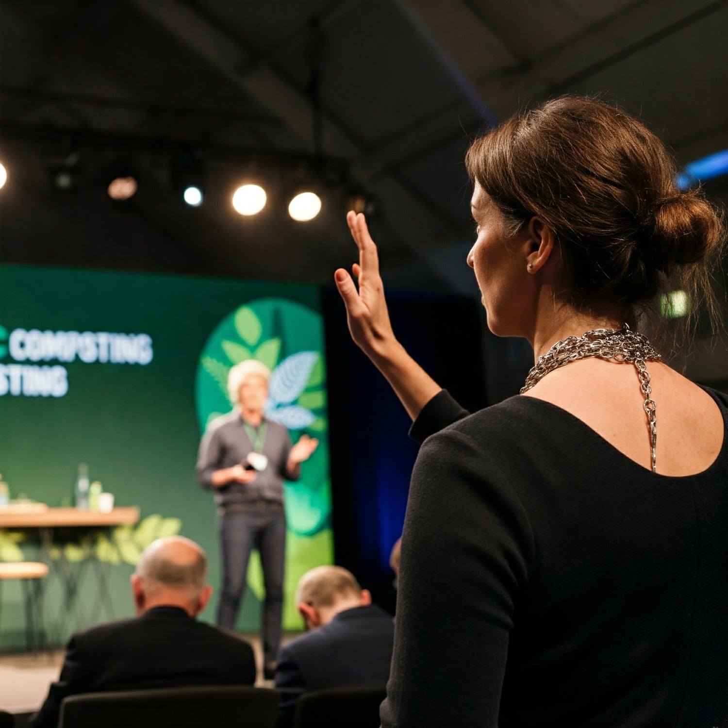 woman-asking-a-question-at-a-composting-conference