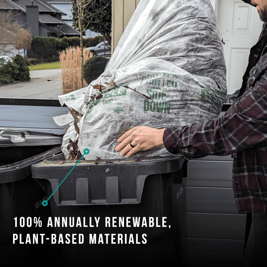 Compostable-Lawn-And-Leaf-Yard-Waste-Tarp-emptied-into-green-bin
